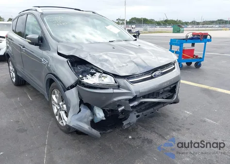 2014 Ford Escape Titanium z USA, uszkodzony, nr VIN 1FMCU0JX3EUA82007